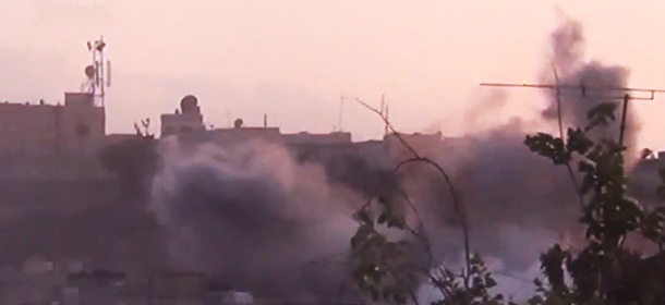 In this image made from amateur video released by the Shaam News Network and accessed Tuesday, June 26, 2012, smoke rises from buildings following purported shelling in Homs, Syria. (AP Photo/Shaam News Network via AP video) TV OUT, THE ASSOCIATED PRESS CANNOT INDEPENDENTLY VERIFY THE CONTENT, DATE, LOCATION OR AUTHENTICITY OF THIS MATERIAL