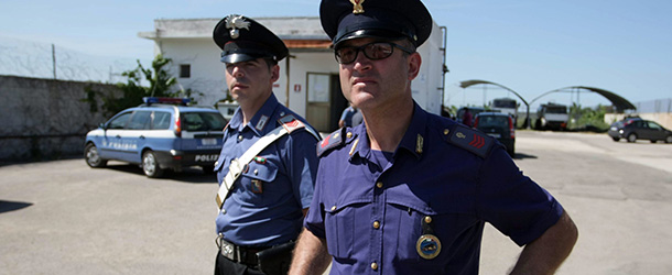 Italian forensic policemen stand outside the house of Giovanni Vantaggiato in Copertino, 50 km south from Brindisi, on June 7 2012. Italian police on June 7 raided a fuel depot owned by a man charged with setting off a bomb at a vocational college in a still unexplained attack that killed a 16-year-old girl and shocked the nation. The 68-year-old Vantaggiato was detained on June 6 and is said to have confessed to last month's attack which also left five teenagers badly burned but prosecutors said they were not convinced by the motive he had provided. AFP PHOTO / CONTROLUCE (Photo credit should read CONTROLUCE/AFP/GettyImages)