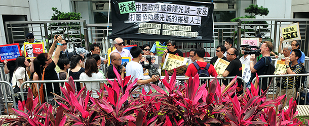 Activists rally in support of blind Chinese activist Chen Guangcheng during a protest in Hong Kong on May 4, 2012. Chen achieved worldwide renown for his work helping to expose abuses under China's "one-child" population-control policy in Shandong, including forced sterilisations and late-term abortions. He was jailed for four years, and placed under unofficial house arrest after he was released from prison in 2010. Chen escaped from house arrest in eastern China last month and sought refuge in the US embassy in Beijing. AFP PHOTO / LAURENT FIEVET (Photo credit should read LAURENT FIEVET/AFP/GettyImages)
