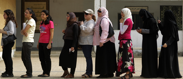 Egyptian women queue outside a polling station in Cairo to cast their votes on June 16, 2012 in a divisive presidential runoff pitting ousted strongman Hosni Mubarak's last premier Ahmed Shafiq against Muslim Brotherhood candidate Mohammed Mursi, two days after the top court ordered parliament dissolved. AFP PHOTO/PATRICK BAZ (Photo credit should read PATRICK BAZ/AFP/GettyImages)