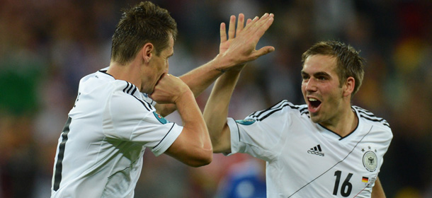 German forward Miroslav Klose (L) celebrates with German defender Philipp Lahm during the Euro 2012 football championships quarter-final match Germany vs Greece on June 22, 2012 at the Gdansk Arena. AFPPHOTO/ PATRIK STOLLARZ (Photo credit should read PATRIK STOLLARZ/AFP/GettyImages)