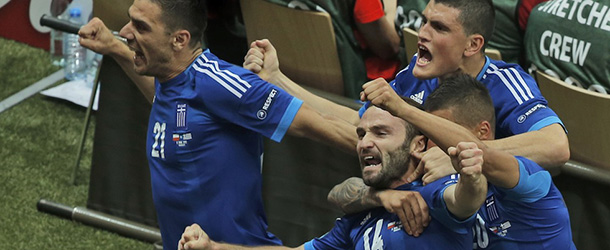 From the left, Greece's Costas Katsouranis, Yiannis Maniatis, Dimitris Salpigidis and Jose Holebas celebrate after they scored against Poland during the Euro 2012 soccer championship Group A match between Poland and Greece in Warsaw, Poland, Friday, June 8, 2012. (AP Photo/Gero Breloer)