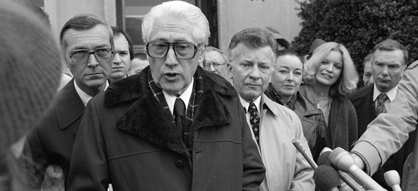 W. Mark Felt, left, answers questions for reporters outside District Court in Washington, Monday, Dec. 15, 1980. Felt and Edward S. Miller, right, were fined a total of $8,500 for approving illegal break-ins during a search for radicals. (AP Photo/Schwarz)