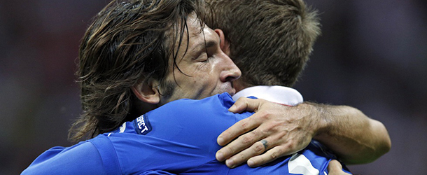Italy's Andrea Pirlo, left, hugs teammate Daniele De Rossi after winning the Euro 2012 soccer championship semifinal match between Germany and Italy in Warsaw, Poland, Thursday, June 28, 2012. (AP Photo/Michael Sohn)