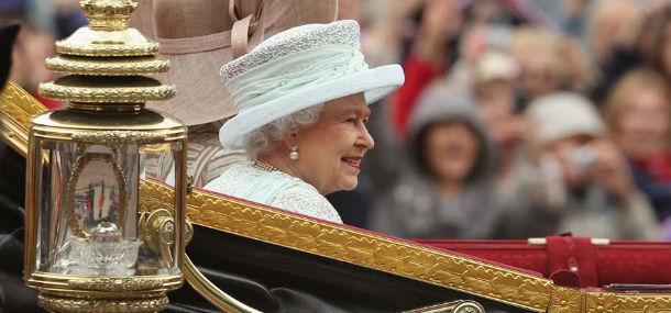 LONDON, ENGLAND - JUNE 05: Queen Elizabeth II rides towards Buckingham Palace in a royal procession during the Diamond Jubilee on June 5, 2012 in London, England. For only the second time in its history the UK celebrates the Diamond Jubilee of a monarch. Her Majesty Queen Elizabeth II celebrates the 60th anniversary of her ascension to the throne. Thousands of wellwishers from around the world have flocked to London to witness the spectacle of the weekend's celebrations. (Photo by Sean Gallup/Getty Images)