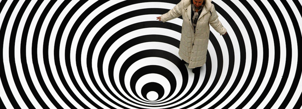 FRANKFURT/MAIN, GERMANY: Italian artist Marina Apollonio poses 16 February 2007 on her work "Spazio ad attivazione cinetica" (1967-1971/2007) shown in the exhibition "Op Art" at the Schirn Kunsthalle museum in Frankfurt/M. From 17 February to 20 May 2007, the museum shows large-format paintings, objects, and environments by artists fascinated by the physical laws of light and optics who dedicated their work to the study of visual phenomena and principles of perception. AFP PHOTO DDP/THOMAS LOHNES GERMANY OUT (Photo credit should read THOMAS LOHNES/AFP/Getty Images)