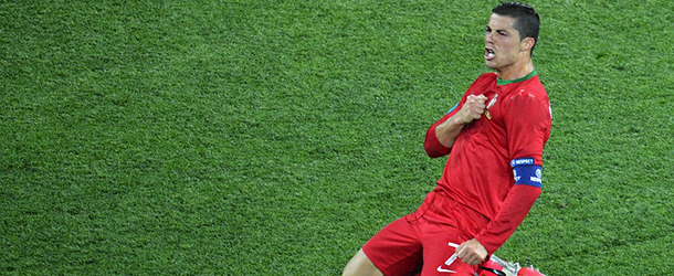 Portuguese forward Cristiano Ronaldo celebrates after scoring his second goal in the Euro 2012 football championships match Portugal vs. Netherlands on June 17, 2012 at the Metalist stadium in Kharkiv. 
 AFP PHOTO / SERGEI SUPINSKY (Photo credit should read SERGEI SUPINSKY/AFP/GettyImages)