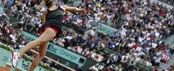 Russia's Maria Sharapova serves to Italy's Sara Errani during their Women's Singles final tennis match of the French Open tennis tournament at the Roland Garros stadium, on June 9, 2012 in Paris. AFP PHOTO / THOMAS COEX (Photo credit should read THOMAS COEX/AFP/GettyImages)
