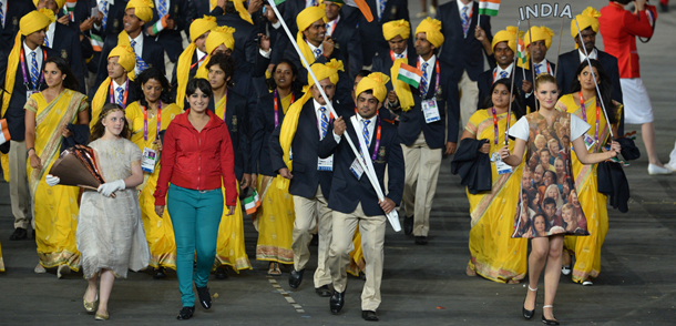 India's flagbearer Sushil Kumar (C) leads his delegation during the opening ceremony of the London 2012 Olympic Games on July 27, 2012 at the Olympic Stadium in London. AFP PHOTO / GABRIEL BOUYS (Photo credit should read GABRIEL BOUYS/AFP/GettyImages)