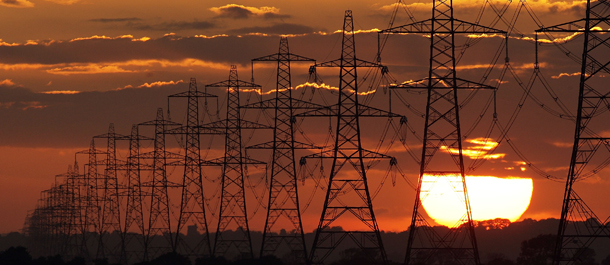 LYDD, UNITED KINGDOM - JULY 25: The sun sets behind power lines running from Dungerness nuclear power station on July 25, 2009 near Lydd, United Kingdom. (Photo by Dan Kitwood/Getty Images)