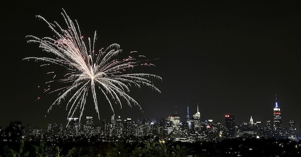 Amateur fireworks explode near Riverview Park in Jersey City, N.J., with the New York City skyline as a backdrop, Wednesday, July 4, 2012. (AP Photo/Julio Cortez)