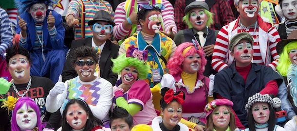 Clowns gather for a group picture during the inauguration of the fourth annual Latin American Clown Congress in Guatemala City, Tuesday, July 24, 2012. Clowns from Central America and South America and the Caribbean have gathered for three days in the capital city to exchange ideas and attend workshops. (AP Photo/Rodrigo Abd)