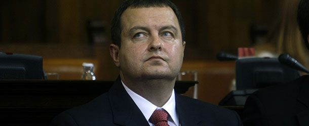 Serbia's prime minister designate, Ivica Dacic, front, looks on during a parliamentary session in Belgrade, Serbia, Thursday, July 26, 2012. Dacic, the wartime spokesman of late strongman Slobodan Milosevic, who has shifted away from the former patron but has also kept some of his trademark features, is set to become Serbia's new prime minister on Thursday, triggering unease despite his proclaimed pro-EU policies. (AP Photo/ Marko Drobnjakovic)