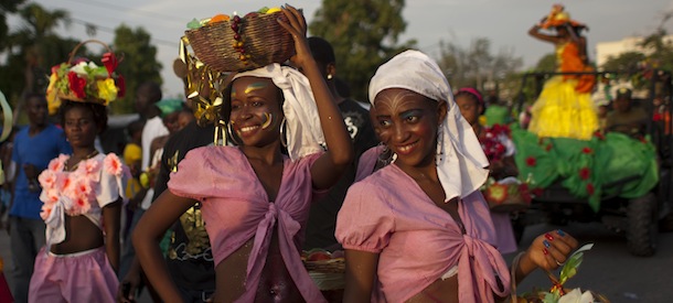 Girls pose for a picture during a parade in Port-au-Prince, Haiti, Sunday, July 29, 2012. (AP Photo/Dieu Nalio Chery)