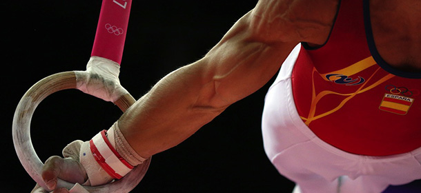 Spain's gymnast Ruben Lopez competes on the rings during the men's qualification of the artistic gymnastics event of the London Olympic Games on July 28, 2012 at the 02 North Greenwich Arena in London. AFP PHOTO / THOMAS COEX (Photo credit should read THOMAS COEX/AFP/GettyImages)