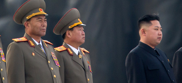This photo taken on April 13, 2012 shows North Korean military chief Ri Yong-Ho (L) and North Korean leader Kin Jong-Un (R) at a ceremony in Pyongyang. North Korea's army chief Ri Yong-Ho has been relieved of all his posts due to illness, state media said on July 16, 2012, in a surprise development that removes one of new leader Kim Jong-Un's inner circle. AFP PHOTO / Ed Jones (Photo credit should read Ed Jones/AFP/GettyImages)