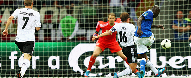 WARSAW, POLAND - JUNE 28: Mario Balotelli of Italy battles with Philipp Lahm of Germany as he scores his team's second goal past Manuel Neuer of Germany during the UEFA EURO 2012 semi final match between Germany and Italy at the National Stadium on June 28, 2012 in Warsaw, Poland. (Photo by Michael Steele/Getty Images)