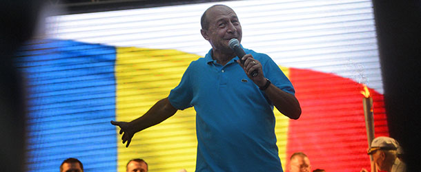 Romanian President Traian Basescu gestures as he speaks to supporters during an electoral rally in Bucharest July 26, 2012. Romanians will vote on July 29 in a referendum regarding the impeachment of Romanian President Traian Basescu. Prime Minister Victor Ponta and his majority left-wing coalition in the Parliament have been pushing for Basescu's removal from office over his support for austerity measures. The European Union has called into question Romania's "respect for democratic institutions," following the center-left government's attempt to impeach conservative President Traian Basescu. AFP PHOTO / DANIEL MIHAILESCU (Photo credit should read DANIEL MIHAILESCU/AFP/GettyImages)