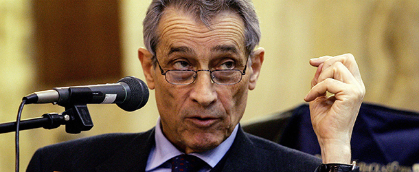 Milan, ITALY: Parmalat Chief Executive Enrico Bondi (R) speaks with prosecutors during a trial against Calisto Tanzi and 15 other people, including several company administrators, at the Milan courthouse 28 February 2006. Bondi's testimony reflected his strategy in dealing with the scandal. As the company's administrator, he launched suits totaling billions of dollars against banks in Italy and abroad, claiming they continued to earn commissions by raising money for Parmalat before the collapse despite knowing about the company's perilous financial state. AFP PHOTO / PACO SERINELLI (Photo credit should read PACO SERINELLI/AFP/Getty Images)