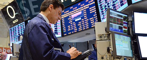 A trader works on the floor of the New York Stock Exchange at the closing bell on July 23, 2012. US stocks skidded amid a global sell-off on renewed eurozone sovereign debt concerns that Spain was headed for a bailout and Greece could exit the eurozone. AFP PHOTO/Stan HONDA (Photo credit should read STAN HONDA/AFP/GettyImages)