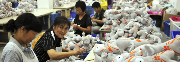 Chinese workers sew up "Wenlock," the mascot of 2012 London Olympic Games, at a factory in Dafeng, in eastern China's Jiangsu province, Sunday, July 8, 2012. (AP Photo) CHINA OUT