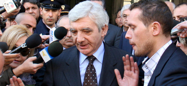 ** FILE ** Italian Police chief Gianni De Gennaro gestures as he is chased by journalists, in Catania, Sicily, in this Feb. 3, 2007 file photo. De Gennaro has been put under investigation for alleged instigation to false testimony in the ongoing inquiry on a police raid and abuse against anti-globalization protesters at the Diaz school during the G8 summit in Genoa, Italy, in 2001, which left one protester shot dead and more than 200 injured, Italian news reported on Thursday, June 21, 2007. (AP Photo/Francesco Saya, files)