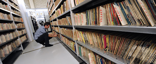 Christian Charles, in charge of relations with radio stations, looks for a vinyl LP on October 19, 2011 in Paris at the music library of the public media group Radio France. AFP PHOTO MIGUEL MEDINA (Photo credit should read MIGUEL MEDINA/AFP/Getty Images)