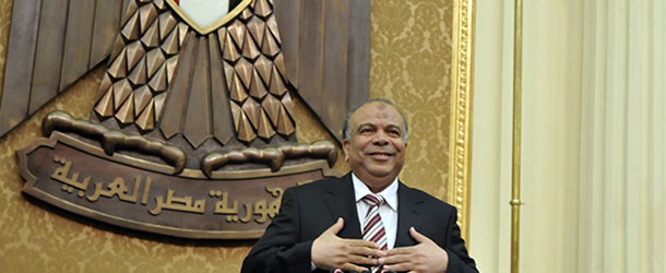 Egyptian Parliament Speaker Saad el-Katani reacts during a brief session of Parliament, the first since the country's high court ruled the chamber unconstitutional, in Cairo, Egypt, Tuesday, July 10, 2012. Egypt's Islamist-dominated parliament convened Tuesday in defiance of a ruling by the country's highest court and swiftly voted to seek a legal opinion on the decision that invalidated the chamber over apparent election irregularities. (AP Photo)