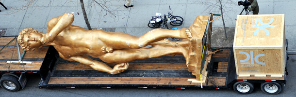 A 30 foot (9.1 meters) replica of Michelangelo's David by Turkish conceptual artist Serkan Ozkaya titled "David (inspired by Michelangelo)" is parked in front of the Storefront for Art and Architecture March 6, 2012 in the Soho area of New York. The statue is in New York for one day before heading to be exhibited at the 21c Museum in Louisville, Kentucky. AFP PHOTO/Stan HONDA (Photo credit should read STAN HONDA/AFP/Getty Images)