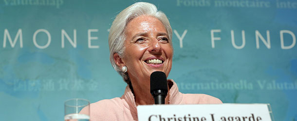 IMF Managing Director Christine Lagarde smiles during a news conference at a Tokyo hotel Friday, July 6, 2012. Lagarde has praise for Japan's move to raise its sales tax to curb the swollen national debt. (AP Photo/Itsuo Inouye)