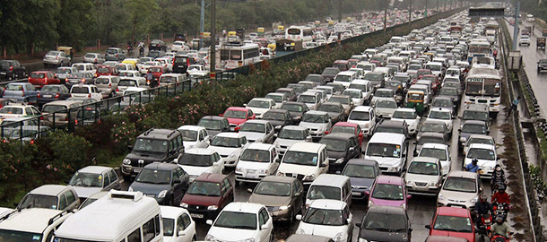 A traffic jam following power outage and rains at the Delhi-Gurgaon road on the outskirts of New Delhi, India, Tuesday, July 31, 2012. India's energy crisis cascaded over half the country Tuesday when three of its regional grids collapsed, leaving 620 million people without government-supplied electricity in one of the world's biggest-ever blackouts. (AP Photo)