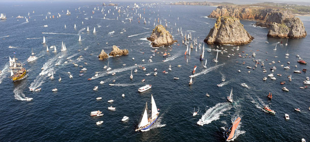 Sailboats parade on July 19, 2012 in the Crozon bay, western France, during the 2012 "Tonnerres de Brest" maritime festival which features thousands of traditional sailboats from 13 to 19 July 2012. AFP PHOTO FRED TANNEAU (Photo credit should read FRED TANNEAU/AFP/GettyImages)