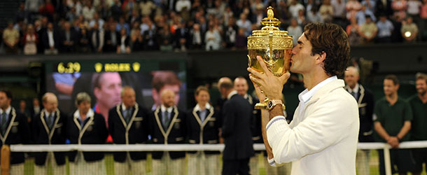 Switzerland's Roger Federer kisses the trophy after his men's singles final victory over Britain's Andy Murray on day 13 of the 2012 Wimbledon Championships tennis tournament at the All England Tennis Club in Wimbledon, southwest London, on July 8, 2012. Federer won the match 4-6, 7-5, 6-3, 6-4. AFP PHOTO/ LEON NEAL RESTRICTED TO EDITORIAL USE (Photo credit should read LEON NEAL/AFP/GettyImages)