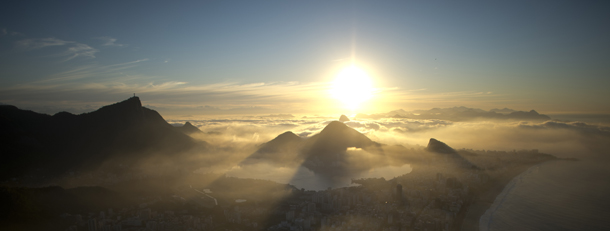 View of the statue of Christ the Redeemer, atop Corcovado Hill, at sunrise in Rio de Janeiro, Brazil on 29 June, 2012. The World Heritage Committee will consider the inscription of 36 sites, including Rio de Janeiro, on the UNESCO?s World Heritage List during its next meeting from 24 June to 6 July, in Saint Petersburg, Russian Federation. AFP PHOTO / Christophe Simon (Photo credit should read CHRISTOPHE SIMON/AFP/GettyImages)