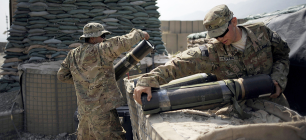 Soldiers of the 4th brigade combat team 4th infantry division of the U.S. Army clean a mortar range at the Forward Operating Base Joyce, in the Kunar province of Afghanistan on August 20, 2012. NATO has some 130,000 troops in Afghanistan who are due to pull out in 2014 and are spending increasing amounts of time working alongside and training Afghan forces who will take over when they leave. AFP PHOTO/ Jose CABEZAS (Photo credit should read Jose CABEZAS/AFP/GettyImages)