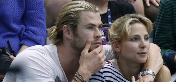 Australian actor Chris Hemsworth, left, and his wife Spanish actress Elsa Pataky watch the men's quarterfinal water polo match between Montenegro and Spain at the 2012 Summer Olympics, Wednesday, Aug. 8, 2012, in London. (AP Photo/Alastair Grant)