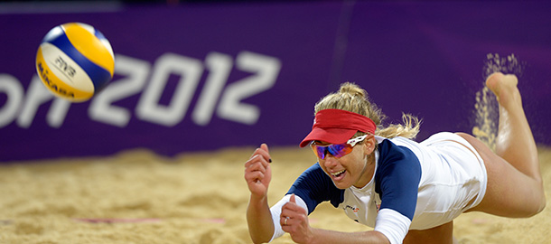 US April Ross looks dives for the ball during the women's beach volleyball preliminary phase Pool B match against The Netherland's Marleen van Iersel and Sanne Keizer on The Centre Court Stadium at Horse Guards Parade in London on July 31, 2012, during the London 2012 Olympic Games. USA won 2-1 AFP PHOTO / DANIEL GARCIA (Photo credit should read DANIEL GARCIA/AFP/GettyImages)