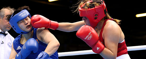 LONDON, ENGLAND - AUGUST 05: Li Jinzi of China (L) in action with Roseli Feitosa of Brazil during the Women's Middle (69-75kg) Boxing on Day 9 of the London 2012 Olympic Games at ExCeL on August 5, 2012 in London, England. (Photo by Scott Heavey/Getty Images)