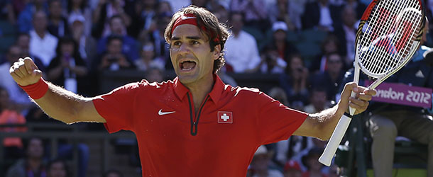Roger Federer of Switzerland celebrates after defeating Juan Martin del Potro of Argentina at the All England Lawn Tennis Club in Wimbledon, London at the 2012 Summer Olympics, Friday, Aug. 3, 2012. (AP Photo/Elise Amendola)