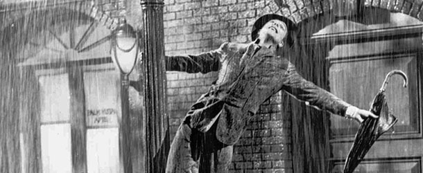 Gene Kelly performs in the 1952 film ``Singin' in the Rain''. Kelly, a dancer and choreographer who brought his athletic grace and Irish charm to ``Singin' in the Rain" and other great movie musicals of the 1940s and '50s, died Friday, Feb. 2, 1996 at his Beverly Hills home his publicist said. Kelly's most memorable dance was the title number of ``Singin' in the Rain,'' in which he splashed joyously through puddles on a near-deserted street, his love for Debbie Reynolds rendering him oblivious to the wet. (AP Photo, files)
