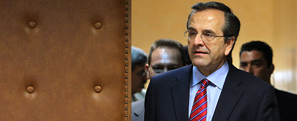 Greece's Prime Minister Antonis Samaras arrives for a meeting with officials at the Finance Ministry in Athens, Wednesday, Aug. 8, 2012. The debt-ridden country has promised to slash euro11.5 billion ($14.1 billion) off its 2013-14 budget in order to continue receiving emergency rescue loans from other eurozone countries and the International Monetary Fund. (AP Photo/Thanassis Stavrakis)