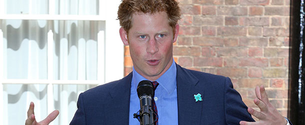 Britain's Prince Harry, president of The School Games, speaks during a reception at Clarence House in London on August 2, 2012. Prince Harry met about 25 athletes and congratulated them on winning medals during the Sainsbury's 2012 School Games, a multi-sport event for the UK's elite young athletes of school age, which was held at the Olympic park in May 2012. AFP PHOTO / POOL / JON BOND (Photo credit should read JON BOND/AFP/GettyImages)