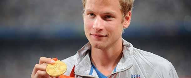 Alex Schwazer of Italy poses on the podium during the men's 50km walk medal ceremony at the "Bird's Nest" National Stadium during the 2008 Beijing Olympic Games on August 22, 2008. Italy's Alex Schwazer took gold with Jared Tallent of Australia in silver and Denis Nizhegorodov of Russian in bronze.
 AFP PHOTO / FABRICE COFFRINI (Photo credit should read FABRICE COFFRINI/AFP/Getty Images)