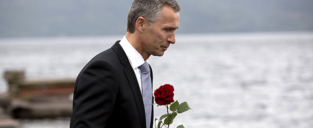 Norway's Prime Minister Jens Stoltenberg holds a flower on his way to the wreath laying ceremony at Utoeya Island on July 22, 2012, with members of the Labor Youth of Norway (AUF), guests and relatives of those who died a year ago. Norway marked the first anniversary of attacks by right-wing extremist Anders Behring Breivik, who killed 77 people in Oslo and on Utoeya Island on July 22, 2011. AFP PHOTO / DANIEL SANNUM LAUTEN (Photo credit should read DANIEL SANNUM LAUTEN/AFP/GettyImages)