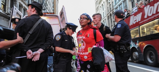 A group of people associated with the Occupy&#8221; movement march is arrested on a march down Broadway in New York enroute to Zuccotti Park, Saturday, Sept. 15, 2012. Monday, Sept. 17, 2012 marks the one year anniversary of the Occupy movement. (AP Photo/Stephanie Keith)
