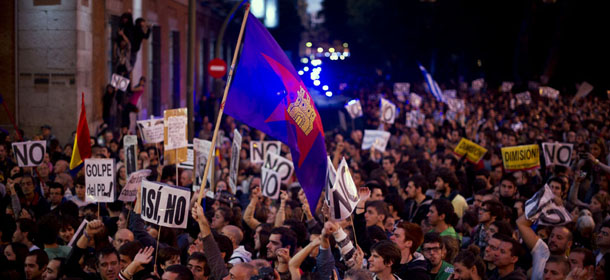 MADRID, SPAIN &#8211; SEPTEMBER 29: Demonstraters shout during a protest against spending cuts and the government of Mariano Rajoy on September 29, 2012 in Madrid, Spain. Demonstrators are protesting for the third time this week near the Spanish Parliament against austerity measures after earlier demonstrations this week brought violence and arrests. (Photo by Jasper Juinen/Getty Images)

