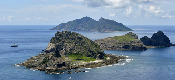 The survey ship Koyo Maru, left, chartered by Tokyo city officials, sails around Minamikojima, foreground, Kitakojima, middle right, and Uotsuri, background, the tiny islands in the East China Sea, called Senkaku in Japanese and Diaoyu in Chinese, Sunday, Sept. 2, 2012. Tokyo city officials planning to buy the islands at the center of a longtime territorial dispute with China surveyed the area Sunday on a visit meant to send a message of ownership. (AP Photo/Kyodo News) JAPAN OUT, MANDATORY CREDIT, NO LICENSING IN CHINA, HONG KONG, JAPAN, SOUTH KOREA AND FRANCE