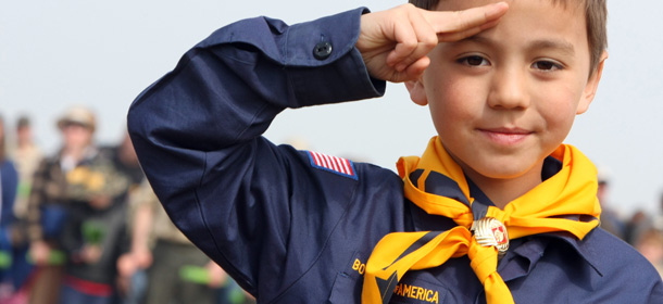 A US boy scout salutes while listening to his country&#8217;s anthem as 3,000 US Boy scouts arrived to write &#8220;in human letters&#8221; : &#8220;Normandy Land of Liberty .. 2014&#8243; on the Saint-Laurent sur Mer beach, dubbed &#8220;Omaha Beach&#8221; during World War II Overlord operation, on April 16, 2011. The event was organized by &#8220;Normandy Memory&#8221; in support to the candidacy of the beach, and other D-Day neighbourging beaches, at the Unesco World Heritage, two years before the 70th anniversary of D-Day. AFP PHOTO / KENZO TRIBOUILLARD (Photo credit should read KENZO TRIBOUILLARD/AFP/Getty Images)
