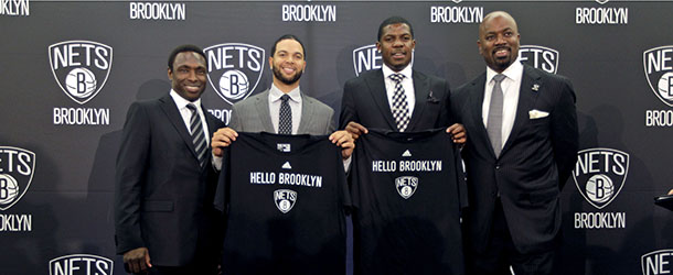 Brooklyn Nets head coach Avery Johnson, from left, players Deron Williams, Joe Johnson, and general manager Billy King pose for photographers during an NBA basketball news conference, Friday, July 13, 2012, in the Brooklyn borough of New York. TheÂ Nets introduced their All-Star backcourt of Williams and newly-acquired Johnson in preparation for their first season in Brooklyn. (AP Photo/Mary Altaffer)