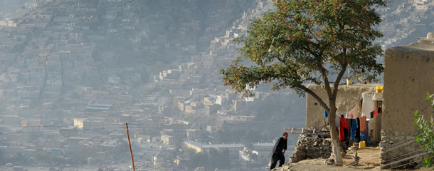 A resident of the hillside neighborhood of Jamal Mina walks up to where he and his family live high above downtown Kabul on September 27, 2012. It is estimated that about 20 percent of the city&#8217;s more less than 5 million residents live on houses built on steep hills that surround the city. Running water was recently installed on some homes in this neighborhood but open sewers run down hill. According to the World Bank more than a third of the population of Afghanistan live below the poverty line, more than half are vulnerable and at serious risk of falling into poverty. AFP PHOTO/Roberto SCHMIDT (Photo credit should read ROBERTO SCHMIDT/AFP/GettyImages)
